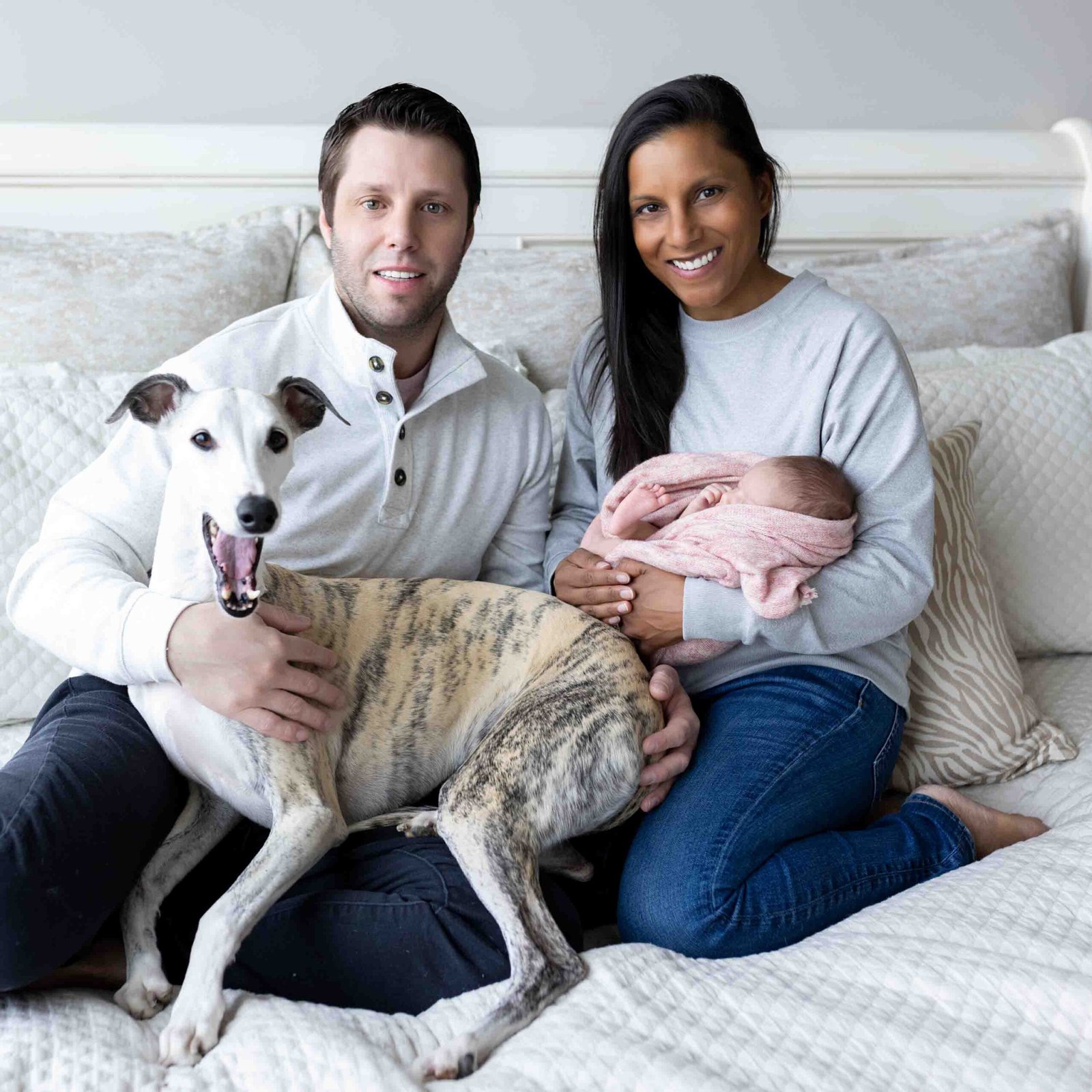 Beautiful, multicultural family has newborn photo session with Malone Portraits.